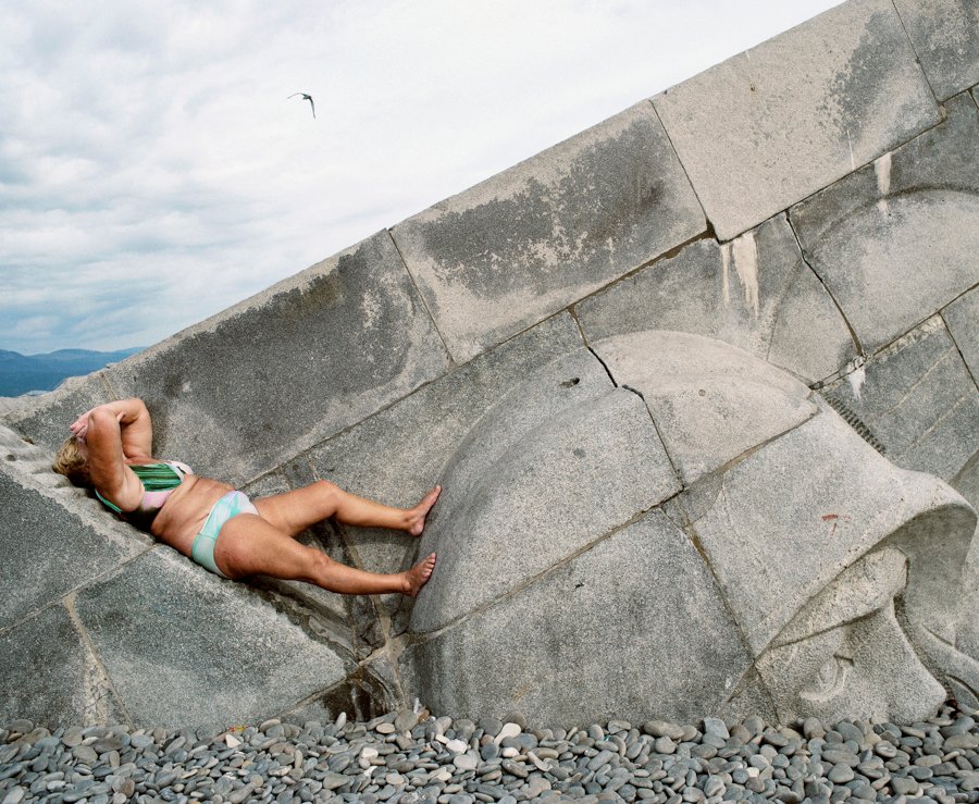A woman lies on an immense memorial at Malaya Zemlya, in Novorossiysk, Russia. The structure represents the Russian defeat of the Germans at this outpost in 1943. Novorossiysk, Russia