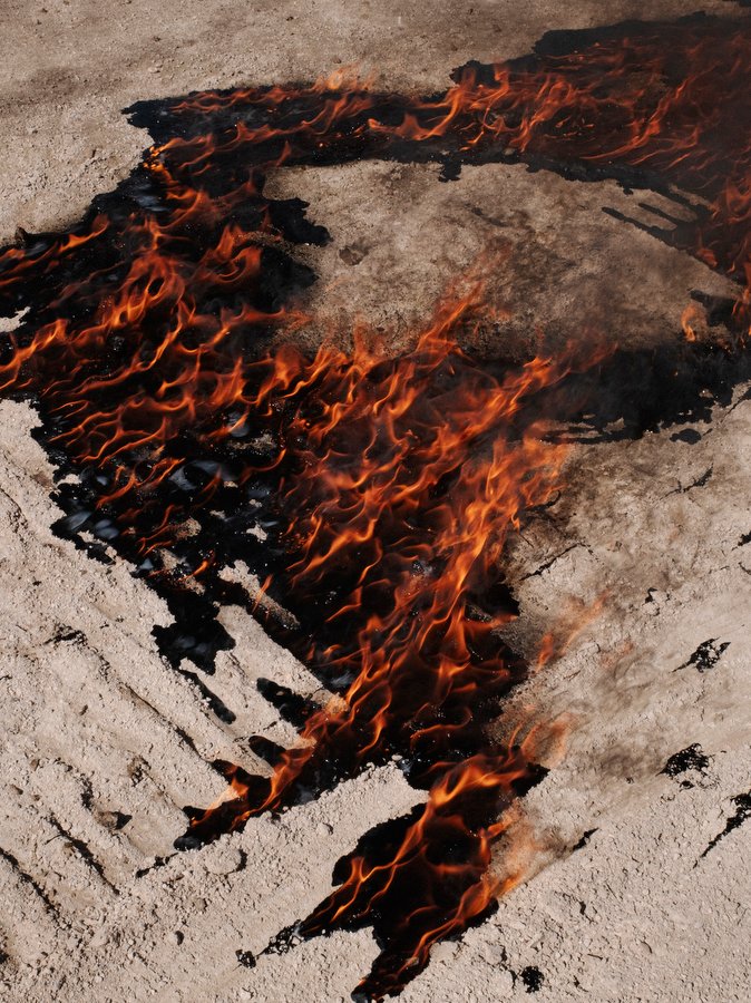 TURKEY. Hasankeyf. 2020. A fire seen near a gas station after people took their belongings and left their city behind, during the last days of Hasankeyf.
The historic city and its 12,000 years old monuments (not moved to the archaeological park) are engulfed since spring 2020, while the city was a protected natural area since 1981. This fate is caused by the Ilisu dam project of the government.