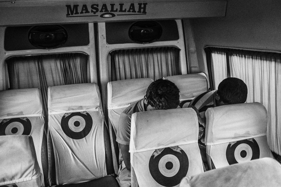 Exhausted refugees just failed to cross the sea from Turkish coast to Greek Island Kos. They are turning back to Bodrum city center by bus. The will try to cross again later. Bodrum - Turkey, july 2015.